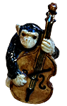 Figutine of monkey playing the cello